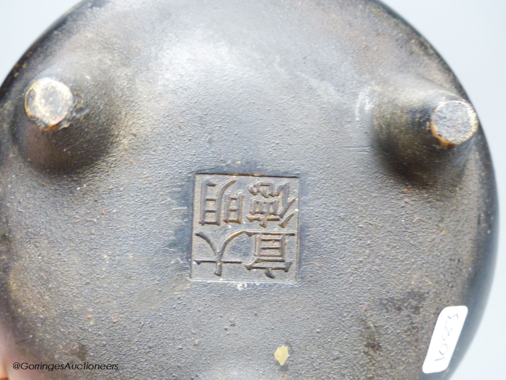 A Chinese bronze tripod censer, Xuande four character mark height 10cm